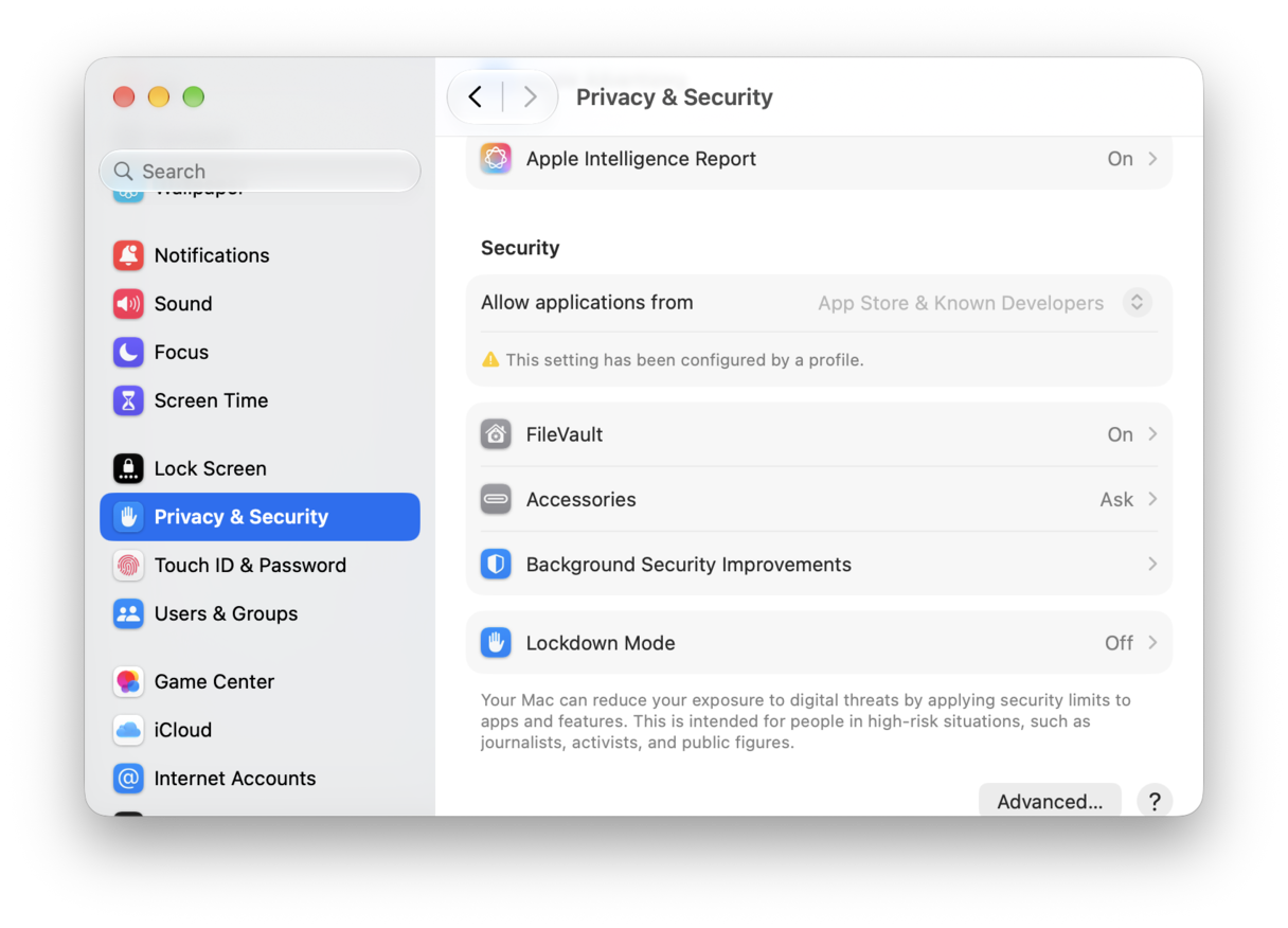 System Preferences - macOS Privacy & Security settings showing FileVault, Lockdown Mode and app permission controls