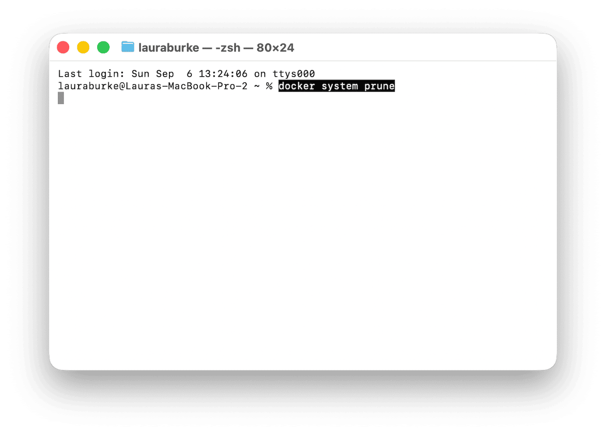 Terminal window running docker system prune command on macOS